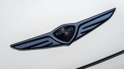 Genesis emblem in blue and blavk