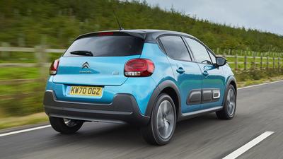 Blue 2020 Citroen C3 driving on road rear