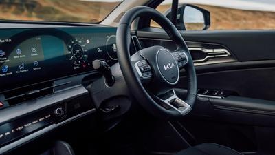 2022 Kia Sportage in black steering wheel and dashboard