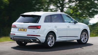 2019 Audi Q7 in white driving rear