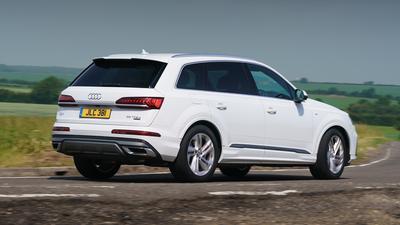 2019 Audi Q7 in white driving rear