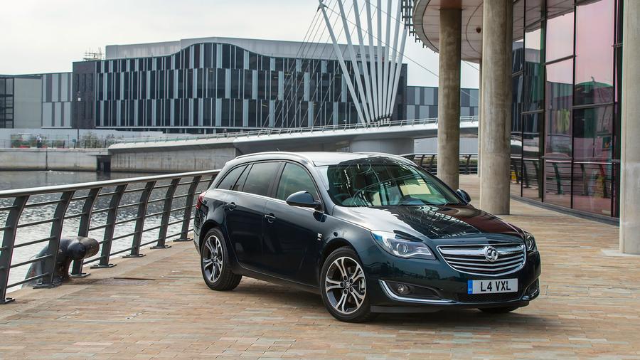 Sweeping headlamps and a deep grille give the front end some drama Vauxhall Insignia Sports Tourer design